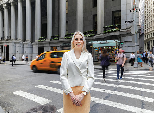 Natalya Krykova stands on Wall Street in NYC