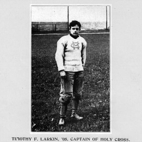 Timothy Larkin wearing an old Holy Cross uniform