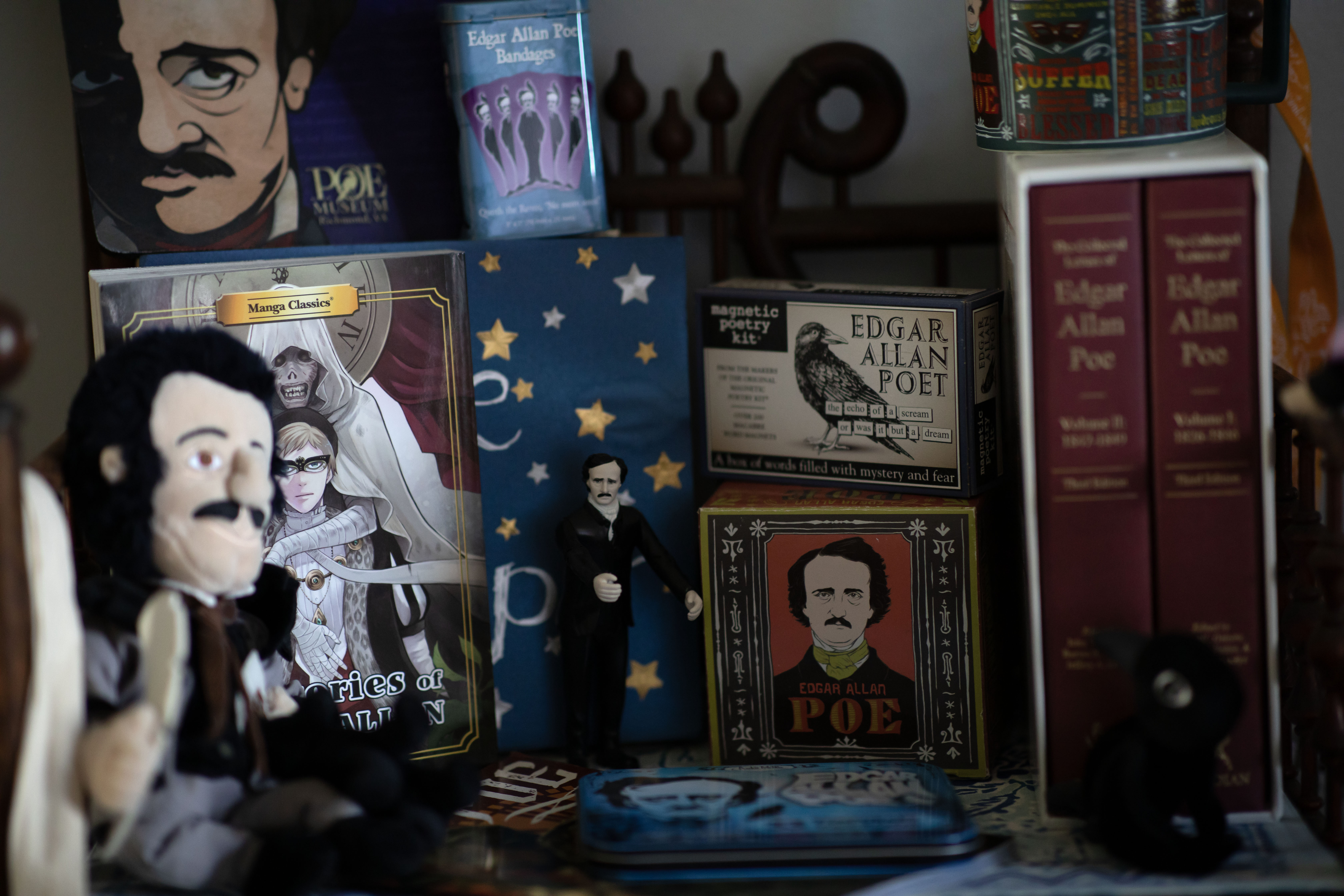 Detail images of Edgar Allen Poe paraphernalia on a shelf