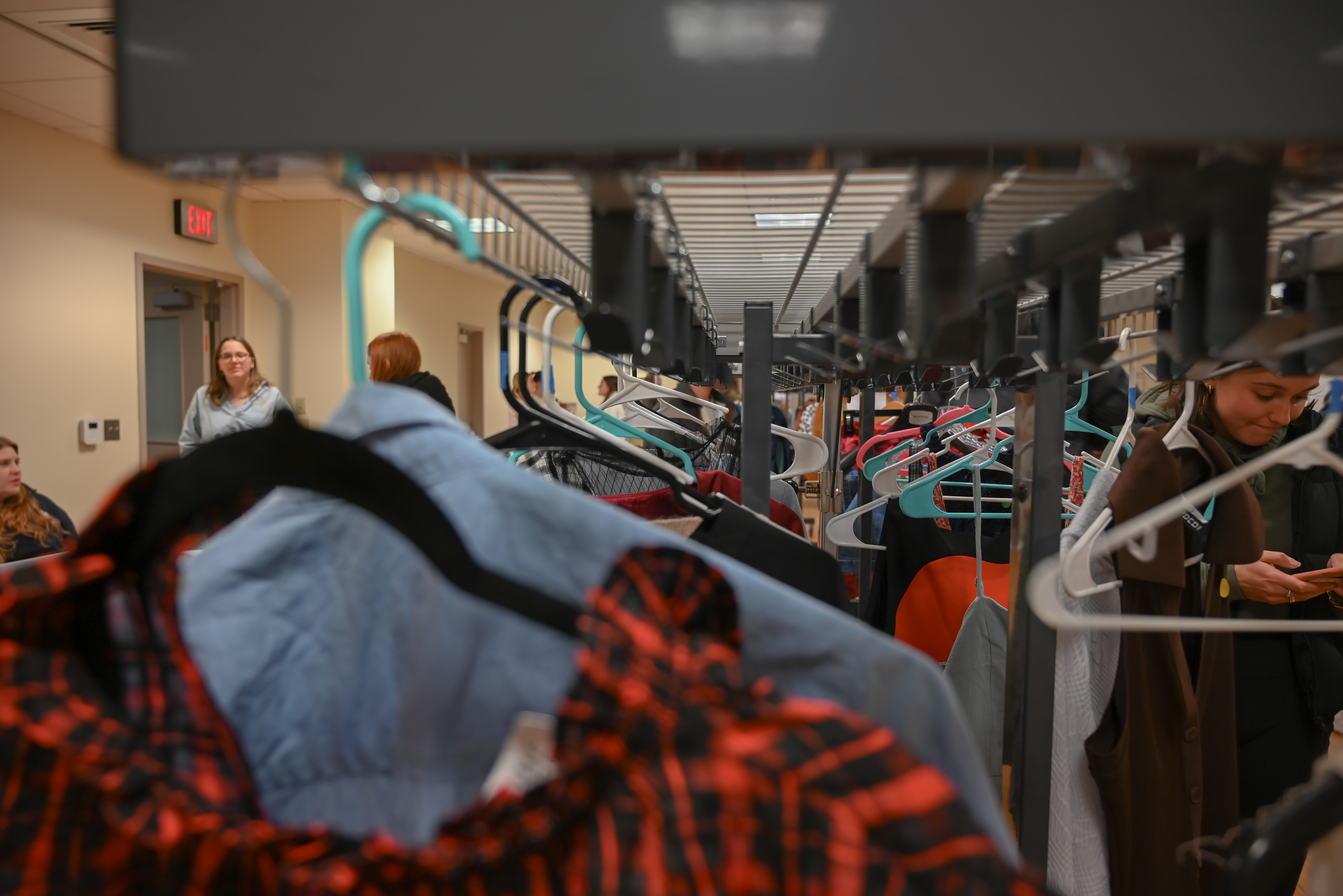 Racks of clothing at a thrift store.