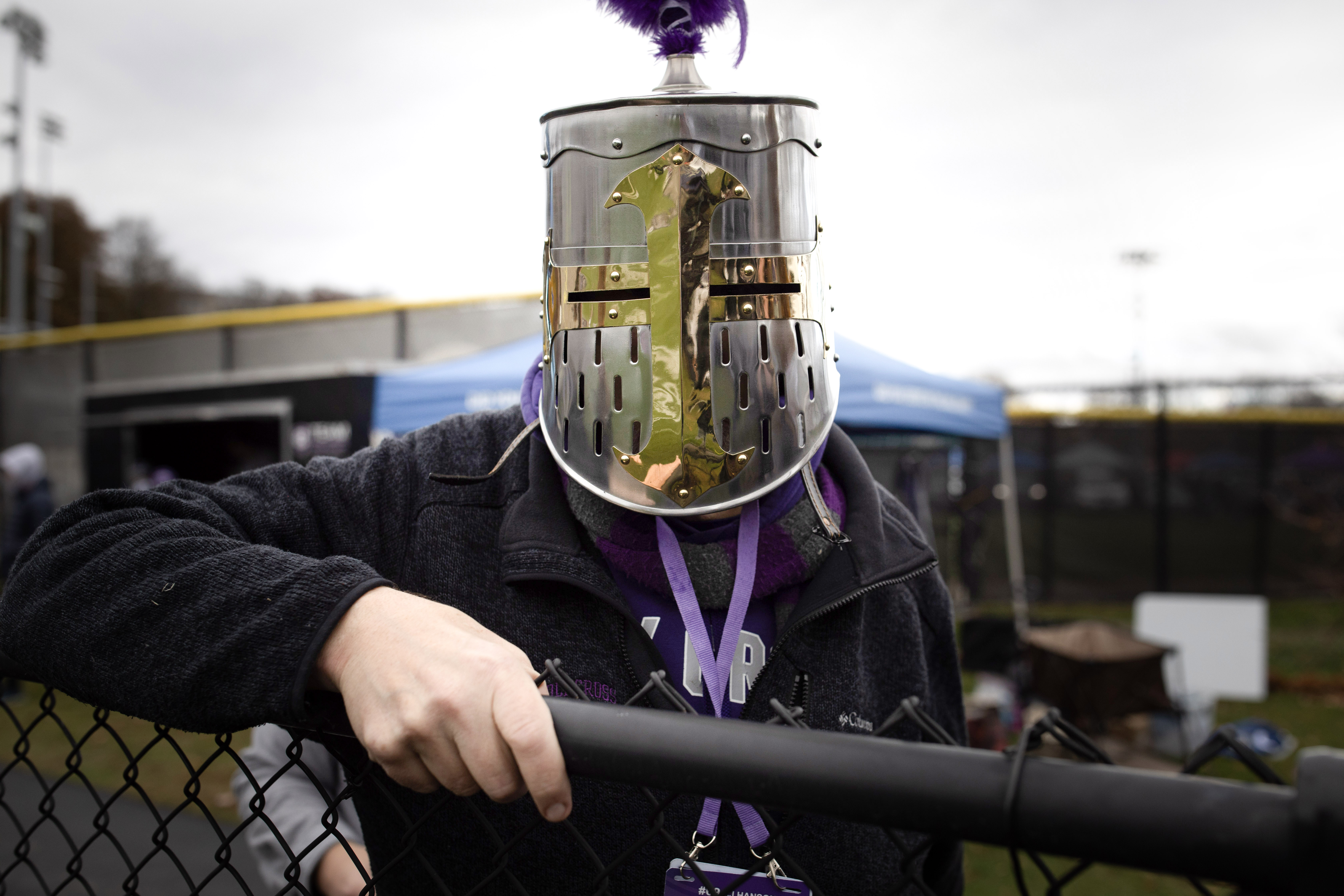 A fan in a knight helmet