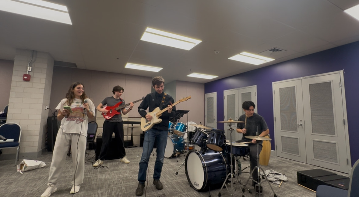 Ellie, Benjamin, Henry and Nikko practicing in the Hogan band room (2025)