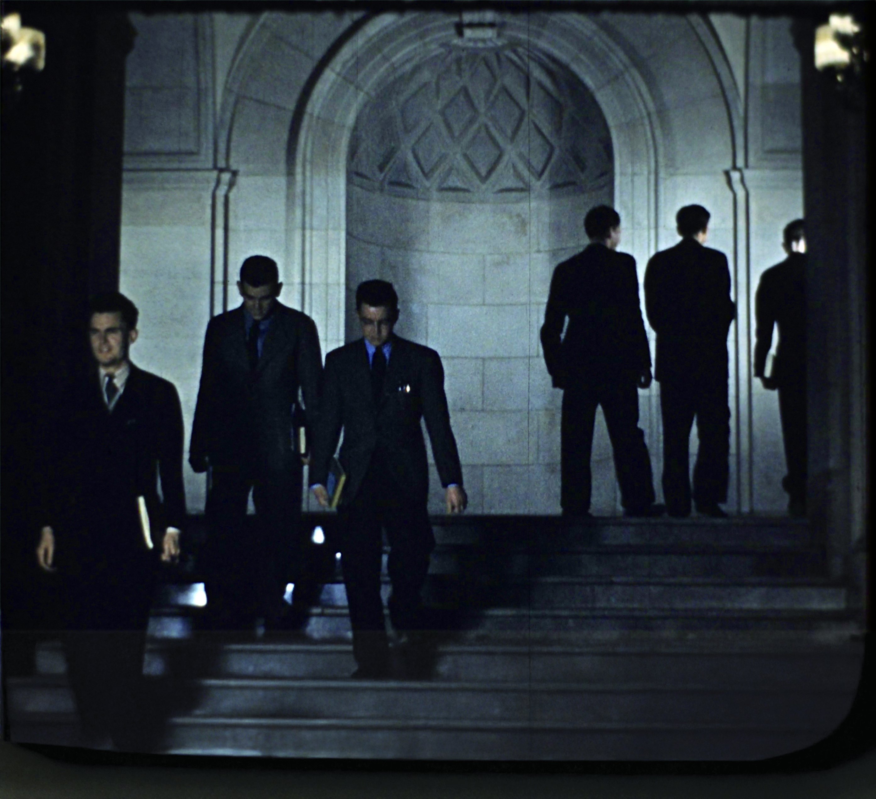 Students walking on stairs inside Dinand Library