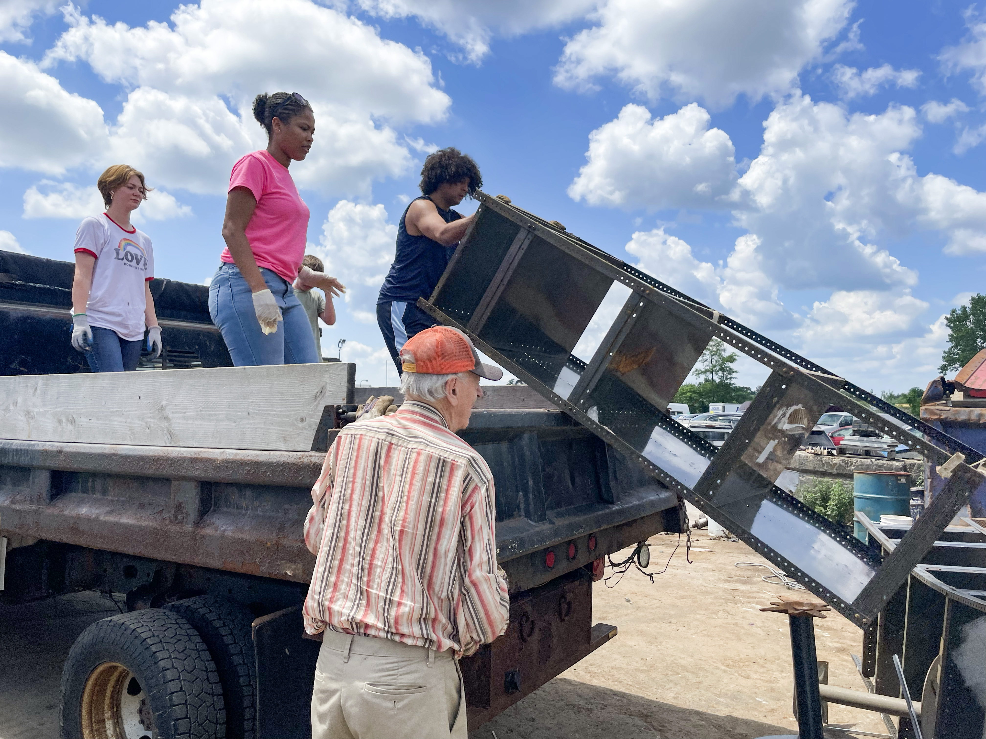 Pushing trash off a truck