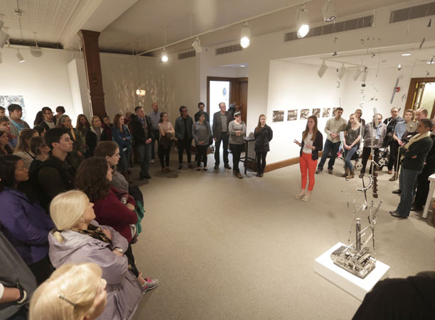 Senior studio art major Mary Welsh '17 speaks to a crowded Cantor Art Gallery about her sculpture &quot;Eruption&quot; during the Academic Conference.