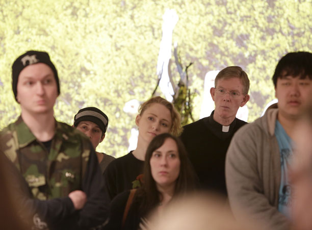 Fr. Boroughs attends the senior studio art major exhibition, “re,” in the Cantor Art Gallery during the Academic Conference.