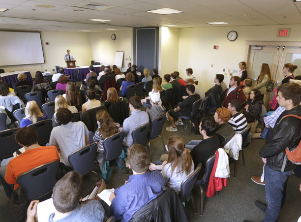 Ryan Kingsley '17, in the departmental English honors program, presents his senior thesis &quot;Bird on the Horizon&quot; to a packed room in the Hogan Campus Center during the Academic Conference.