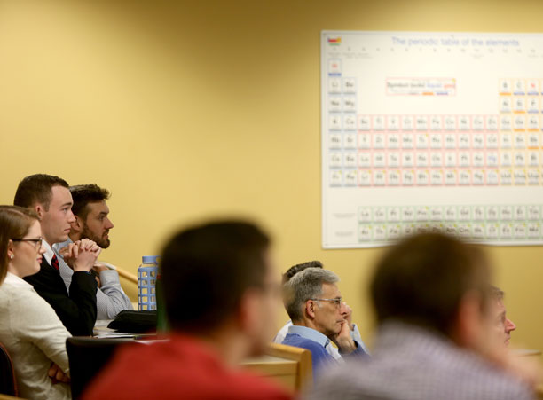 Faculty and students listen to the chemistry presentation of Suhasini Aravinthan '18 during the Academic Conference.