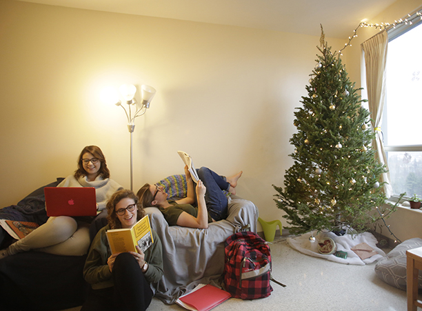 Laura Lopez '18, Emma Kuper '18 and Catherine Hershey '18 get back to studying after decorating their residence hall for Christmas.