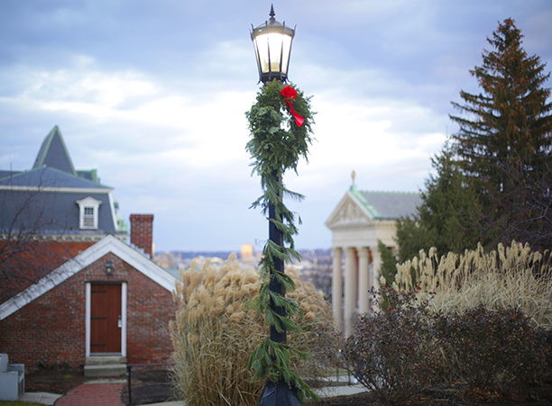 Wreathes adorn lampposts across campus.
