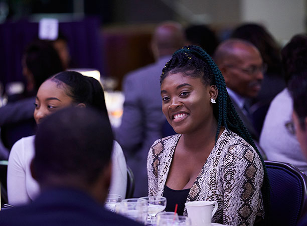A woman smiles during Loretta Lynch's keynote address.