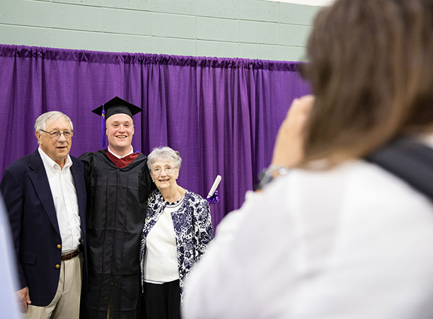 Students celebrate with their friends and family at the reception following the ceremony.