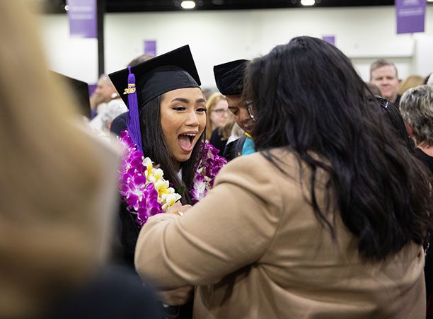 Students celebrate with their friends and family at the reception following the ceremony.