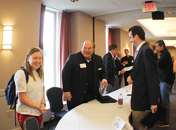 A student talks to Judge Richard Leon.