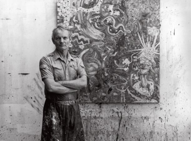 American expressionist Robert Beauchamp stands in his Manhattan studio circa 1980.