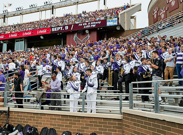 crowds cheer for Holy Cross football