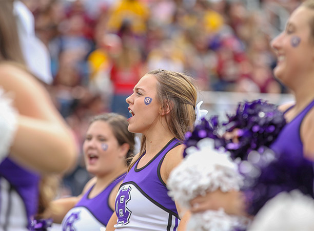 cheerleader cheers during game