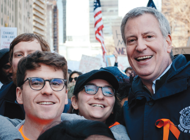 New York City Mayor Bill de Blasio poses for a photo with Clavering