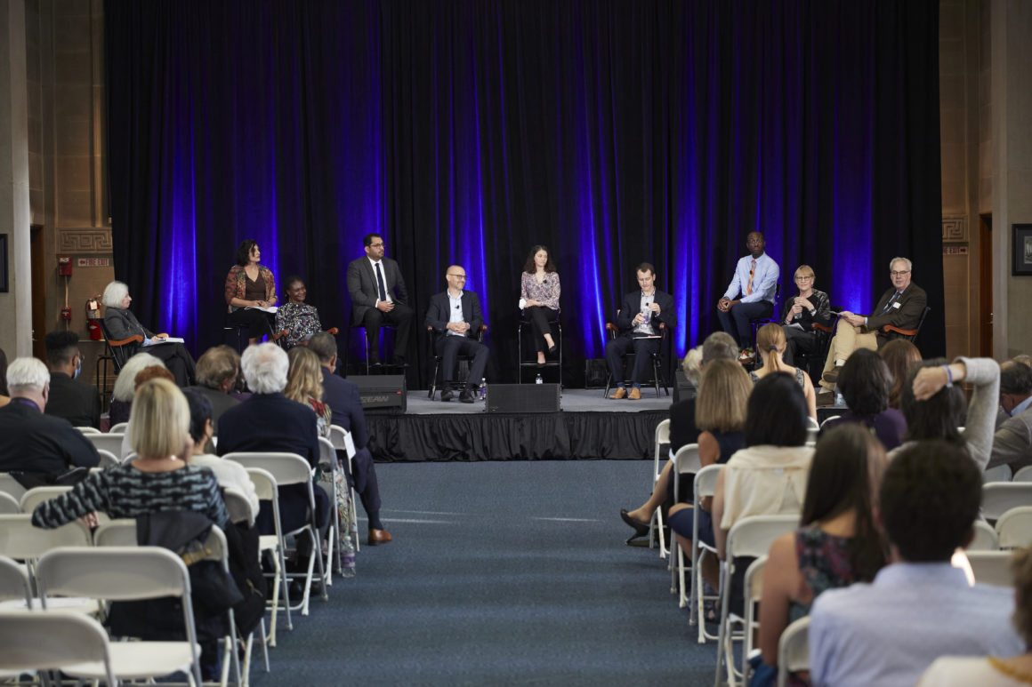 Nine Holy Cross faculty members are participating in a panel discussion at a faculty symposium held in Dinand Library. Photo by Michael Quiet