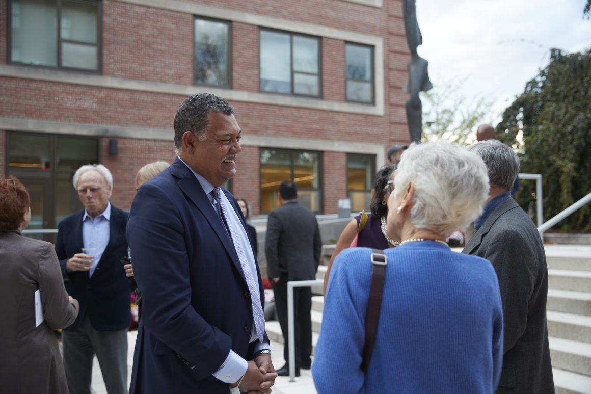 President Rougeau is interacting with faculty symposium guests in Science Plaza. Photo by Michael Quiet