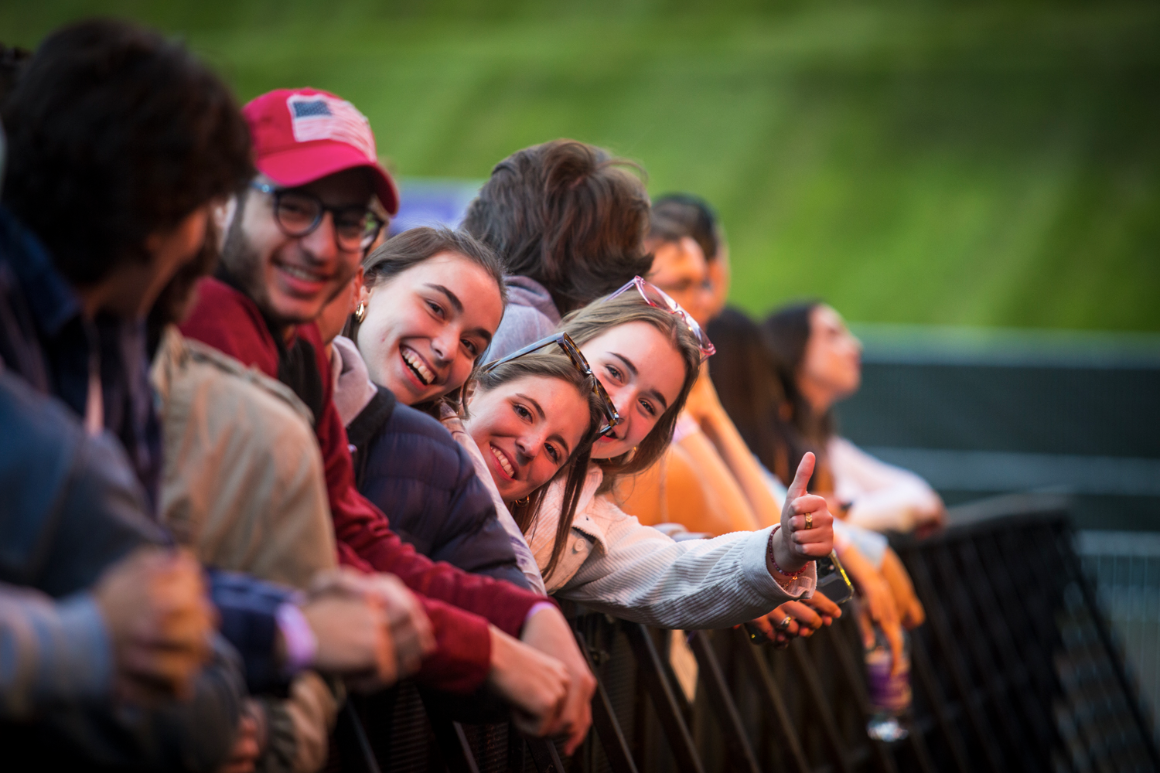 Students pose together for a photo at a campus concert.
