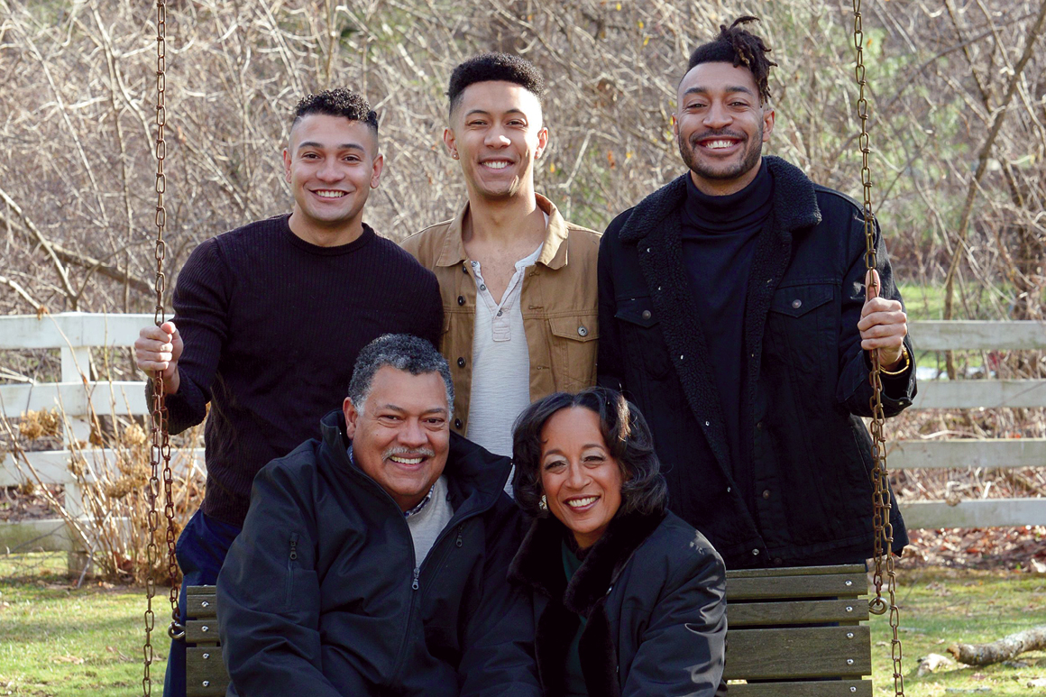 Rougeau with his wife, Robin Kornegay-Rougeau, M.D., their three sons, Christian, Alex and Vincent Jr. (“V.J.”), and family dog, Violet, at their home in Massachusetts.