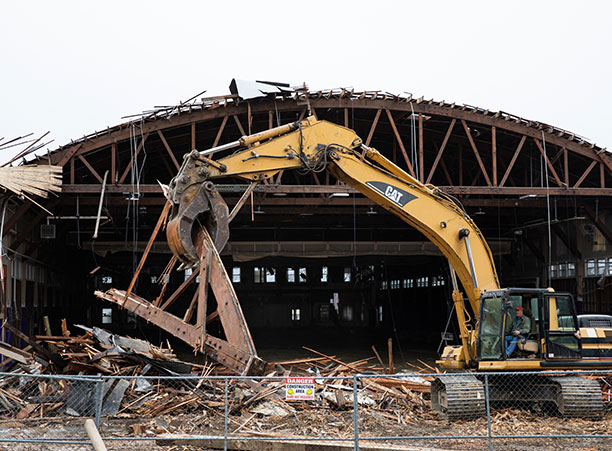 A large piece of construction machinery tears into the Field House