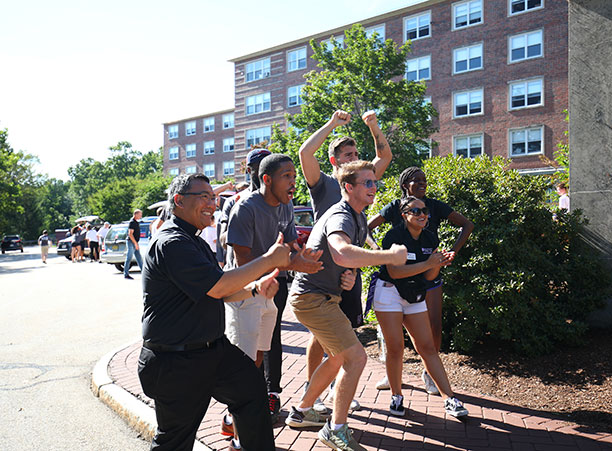 students and faculty cheer for incoming students