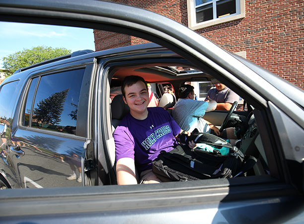 a student steps out of his car