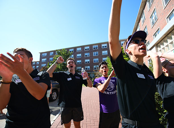 students and faculty cheer for incoming students