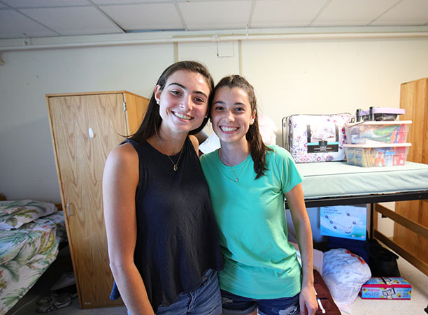 two roommates smiling