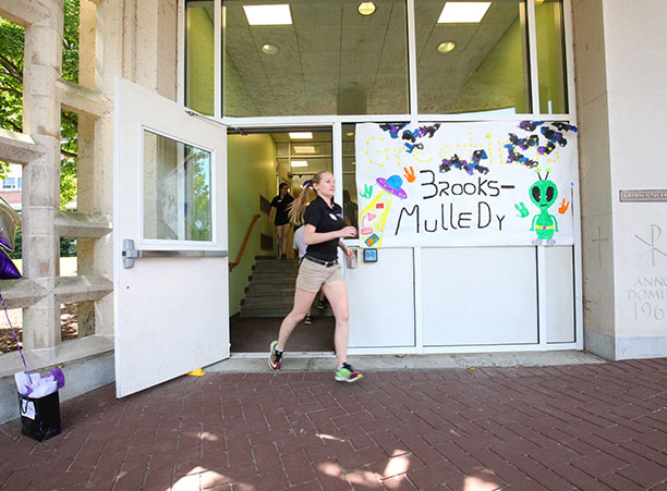 a student runs out of brooks-mulledy hall