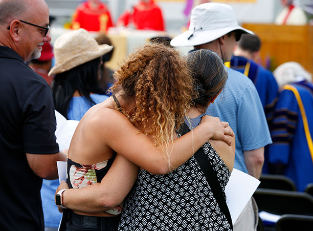 a student hugs their parent