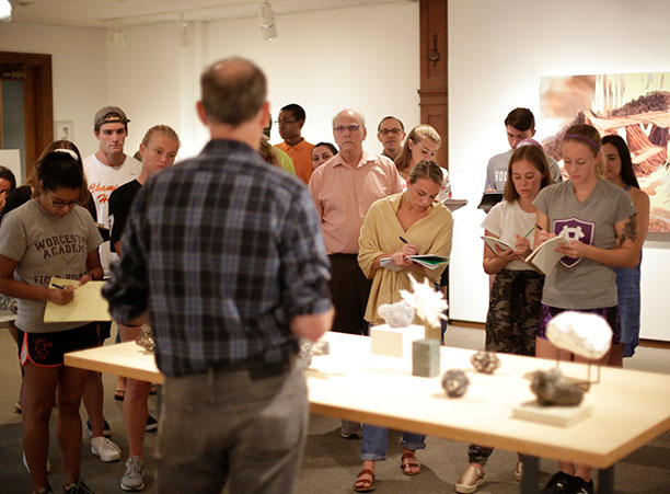 Michael Beatty explains his artwork to a group of students