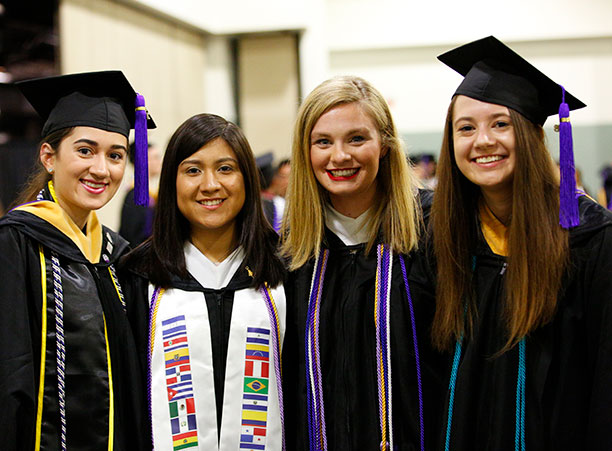 Students celebrate at the reception following commencement.