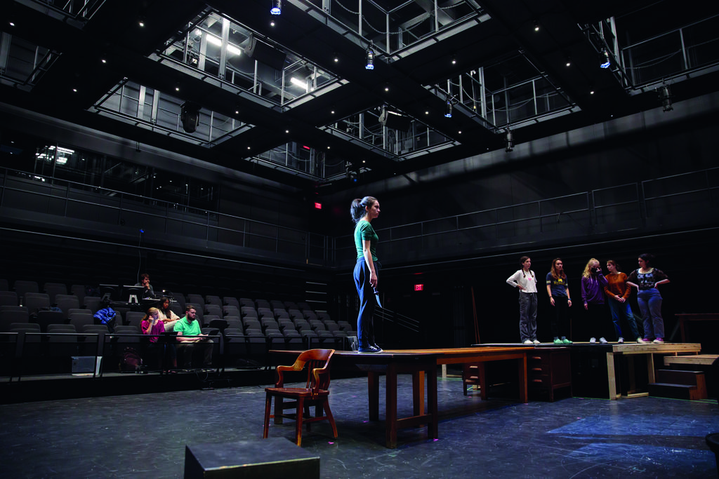 Student performs in a theater.