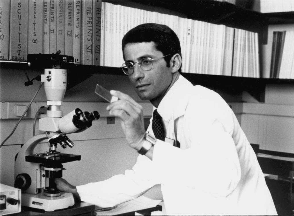 Archival photo of Anthony Fauci with lab equipment.