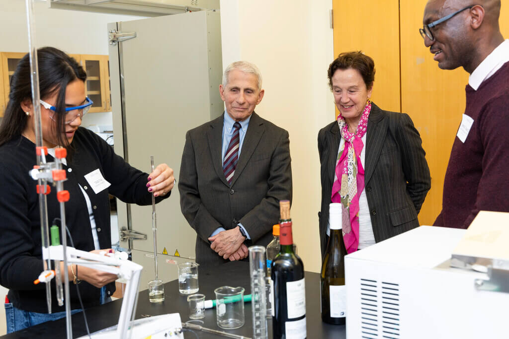 Two men and a woman in a lab