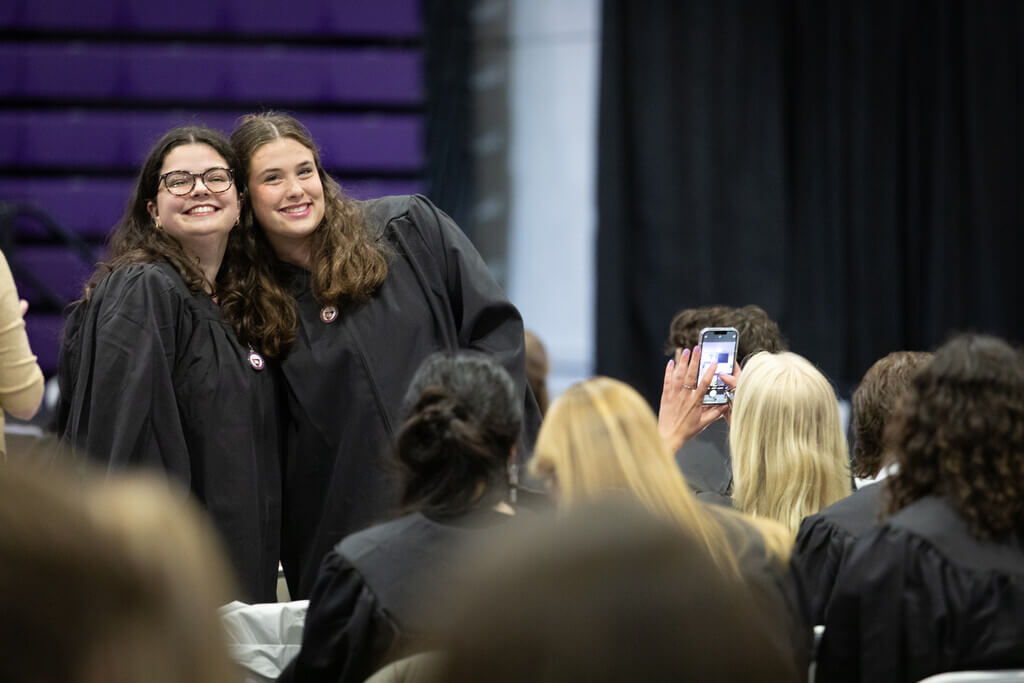 Pair of students pose for photo