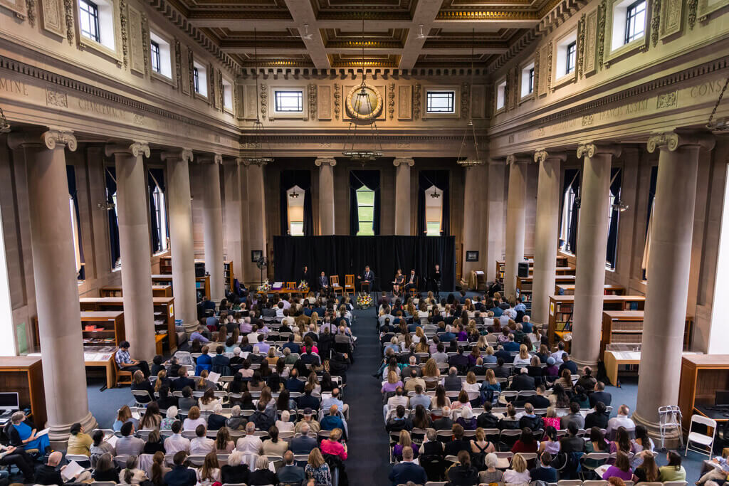 Students assembled in Dinand Library at the College of the Holy Cross for the 2025 Presidential Service Awards ceremony.