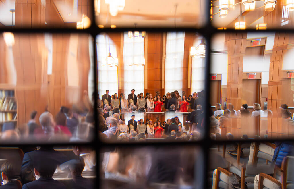 Students assembled in Rehm Library at the College of the Holy Cross for the 2025 for the induction of new members into the Phi Beta Kappa National Honor Society.