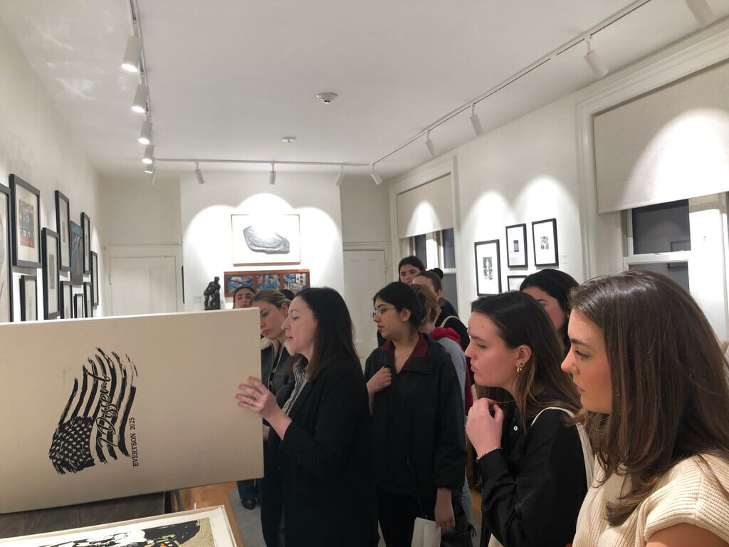 students look at artwork