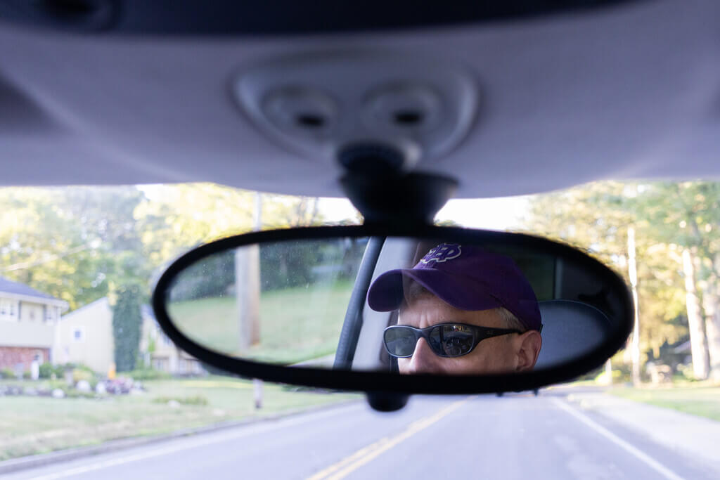 Face in rear view mirror