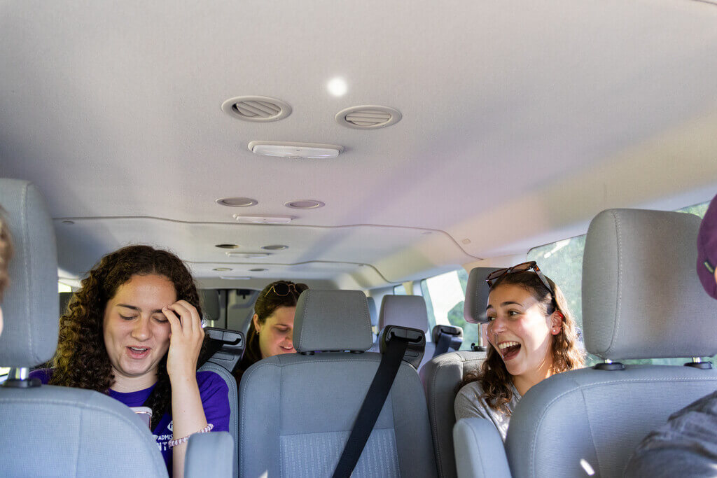 Three students in a van