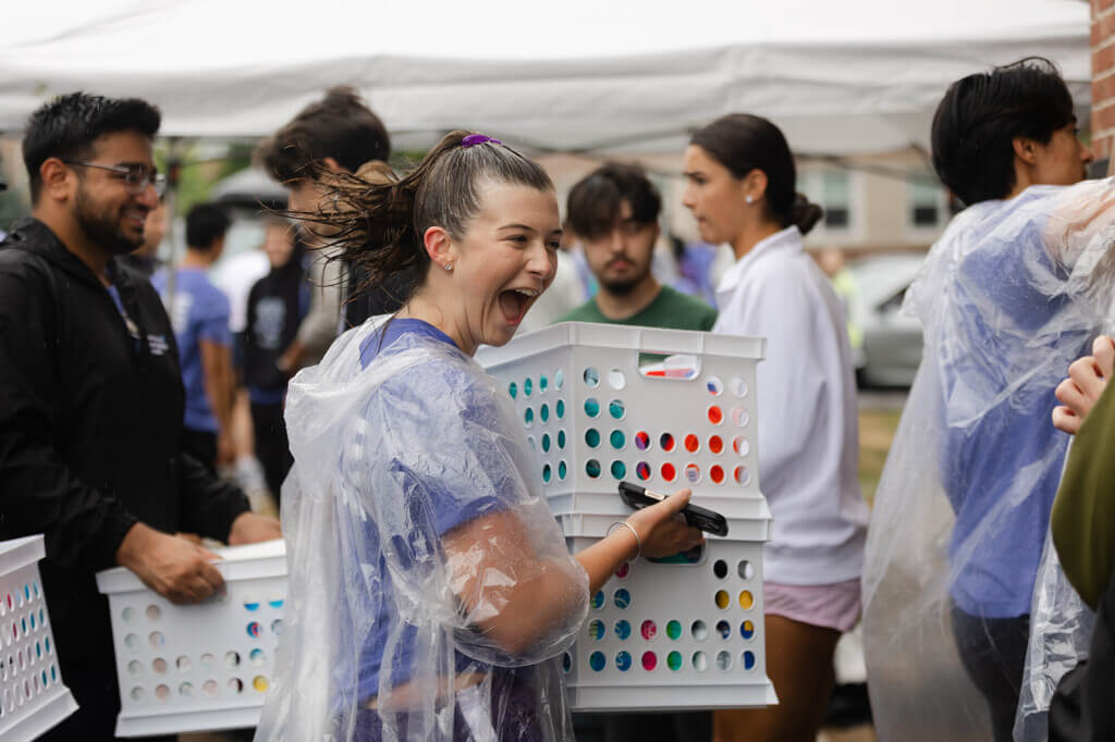 Students carrying crates