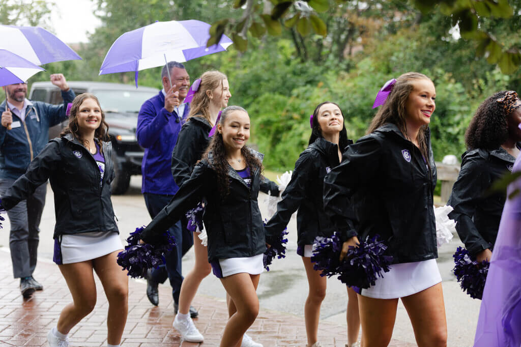 Charles Todd, Vincent Rougeau, and Holy Cross cheerleaders