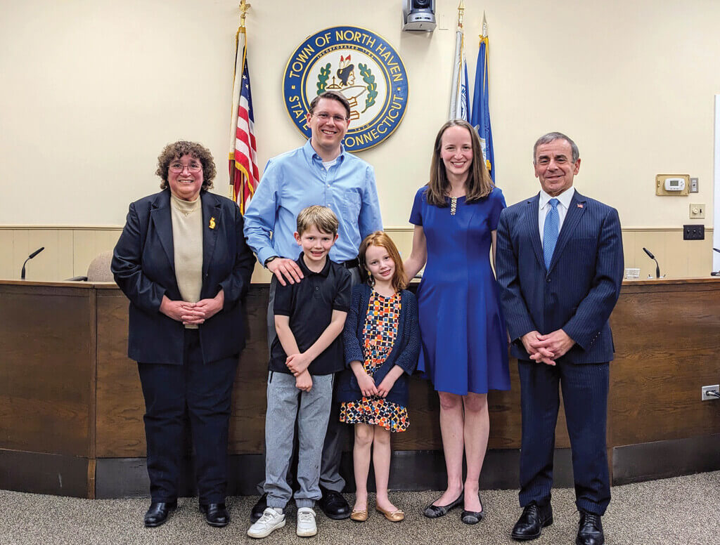 Group photo of Luoma, her family, and North Haven selectmen