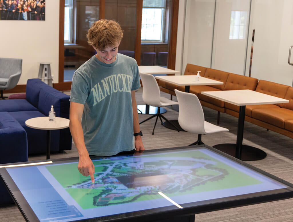Student using an interactive touch table
