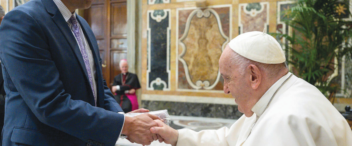 two men shake hands