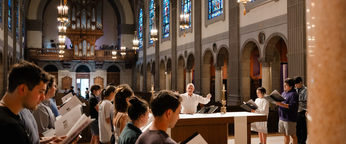 Students singing Gregorian chant in St. Joseph Chapel